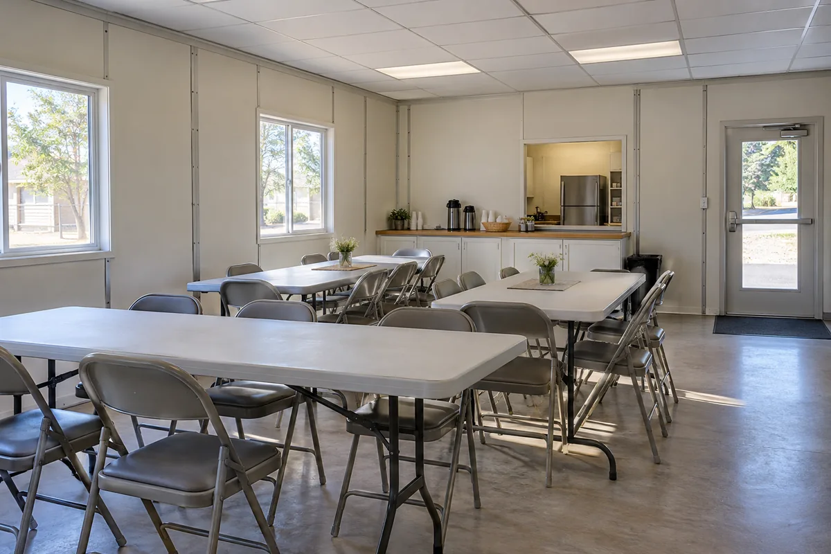 Multipurpose community room with tables and chairs