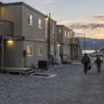 Workers returning to connected modular workforce housing at a remote project site